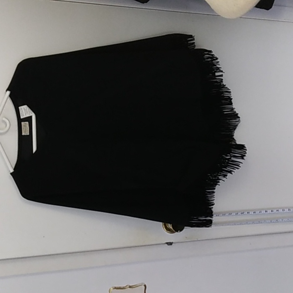 Black tassled cape